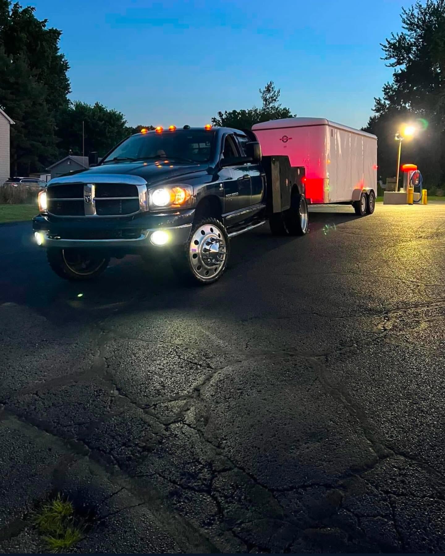 La Familia truck and trailer ready for a dumpster delivery in Canton, OH